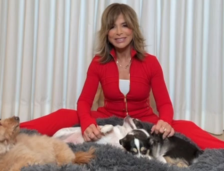 Paula Abdul sitting with her dogs